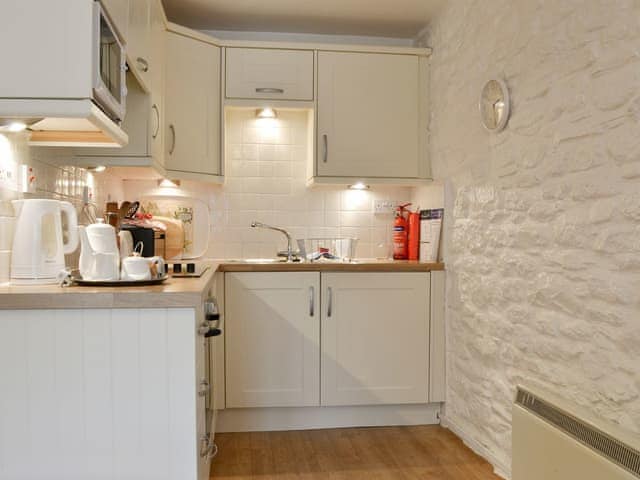 Compact kitchen area | TrethinDovecote, Advent