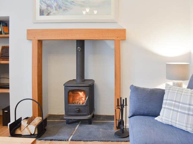 Relax and unwnid in front of the delightful fireplace | Hovera, Glenridding, near Penrith