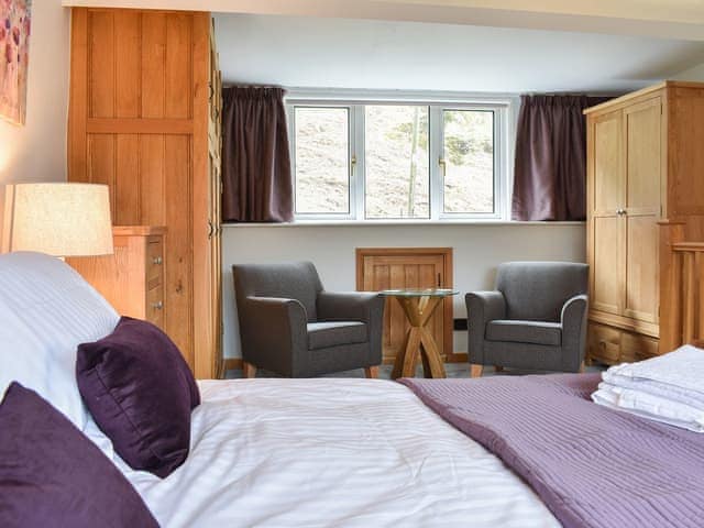 Bedroom with hotel-style seating area | Hovera, Glenridding, near Penrith