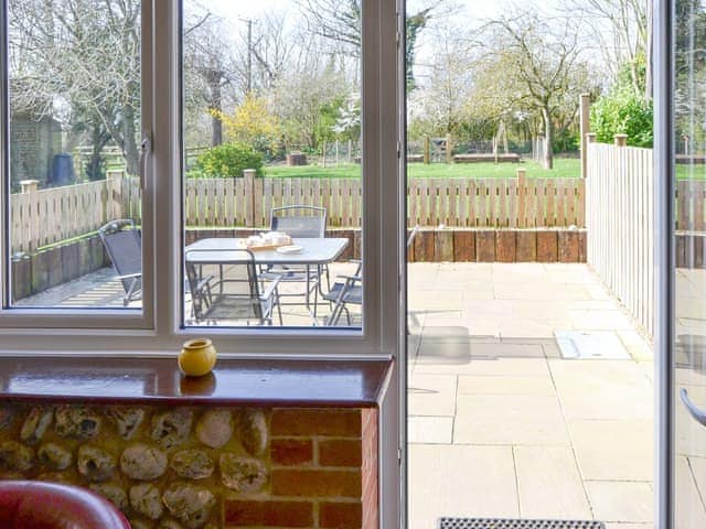 Access from living area to the enclosed paved patio area | The Granary - White House Farm Holiday Cottages, Knapton, near North Walsham