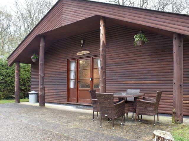 Patio area with outdoor furniture | Hornbeam Lodge - Eversleigh Woodland Lodges, Shadoxhurst, near Ashford