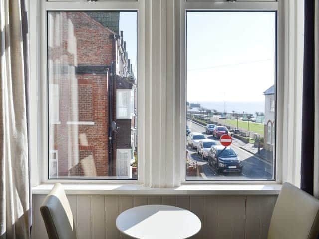 Intimate dining area within the living room | The Harbour Master&rsquo;s House, Bridlington