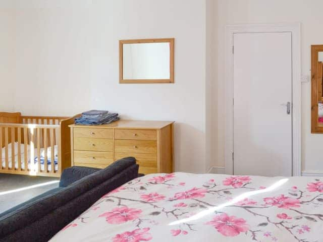 Double bedroom with cot | The Harbour Master&rsquo;s House, Bridlington