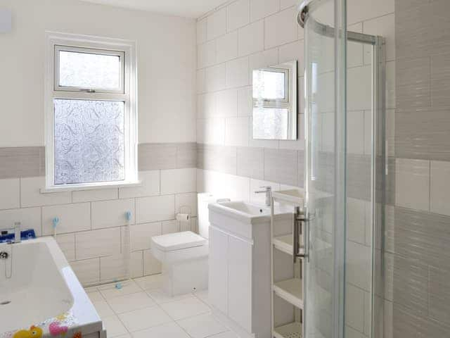 Bathroom with bath and separate shower cubicle | The Harbour Master&rsquo;s House, Bridlington