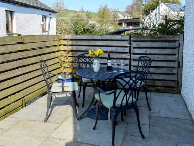 Enclosed courtyard patio with garden furniture | Rock Cottage, Crosthwaite