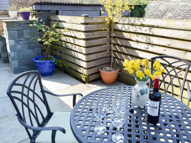 Enclosed courtyard patio with garden furniture | Rock Cottage, Crosthwaite