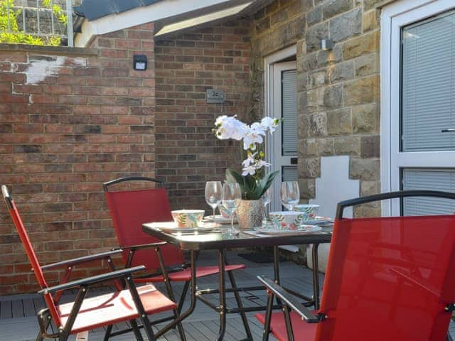 Enclosed sitting-out area with garden furniture | The Hideaway, Sleights, near Whitby