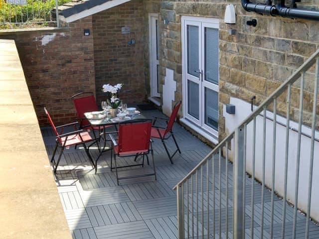 Enclosed sitting-out area with garden furniture | The Hideaway, Sleights, near Whitby