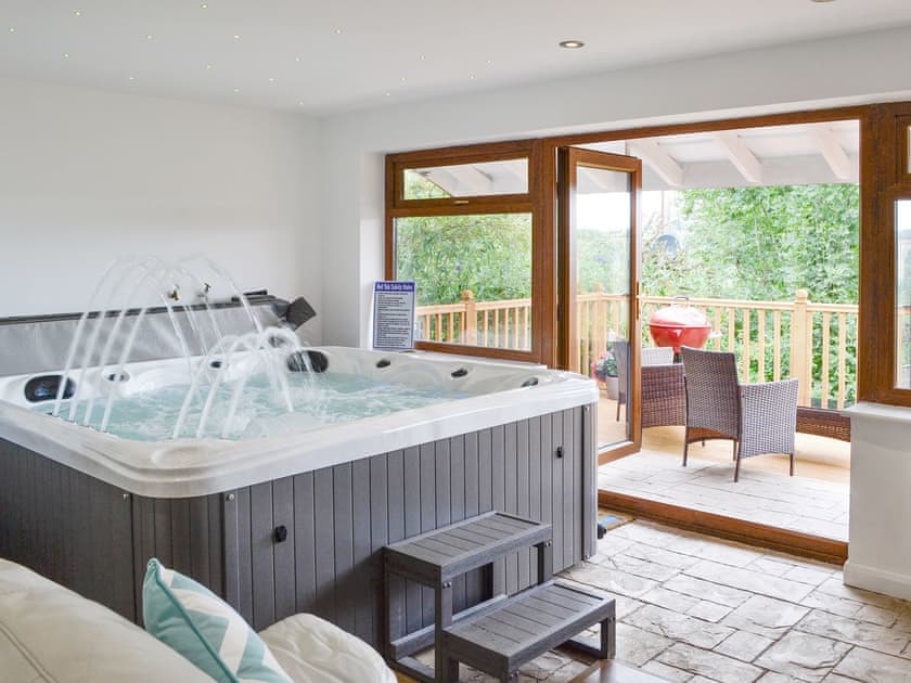 Hot tub room with French doors to decked terrace | Canalside Cottage, Pentre, near Llangollen