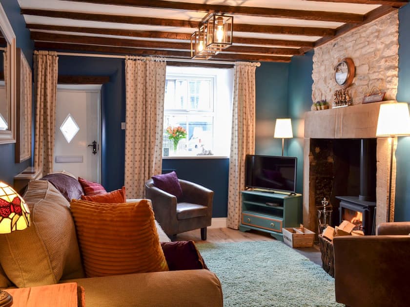 Cosy living/dining room with wood burner | Parsley Cottage, Tideswell, near Buxton