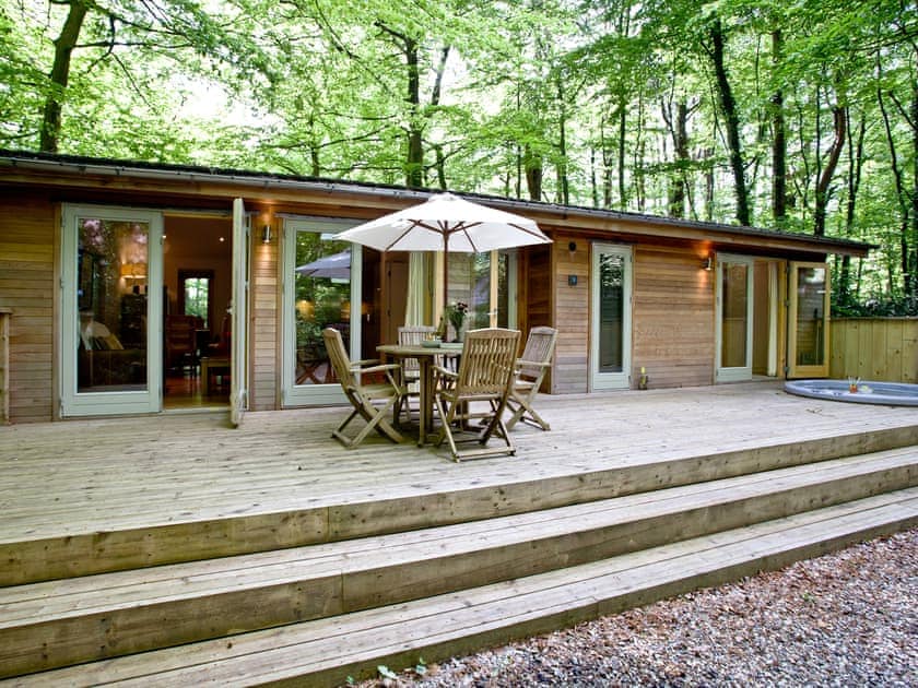 Large decked area with hot tub and seating | Huccaby Lodge, 3 Indio Lake - Indio Lake, Bovey Tracey