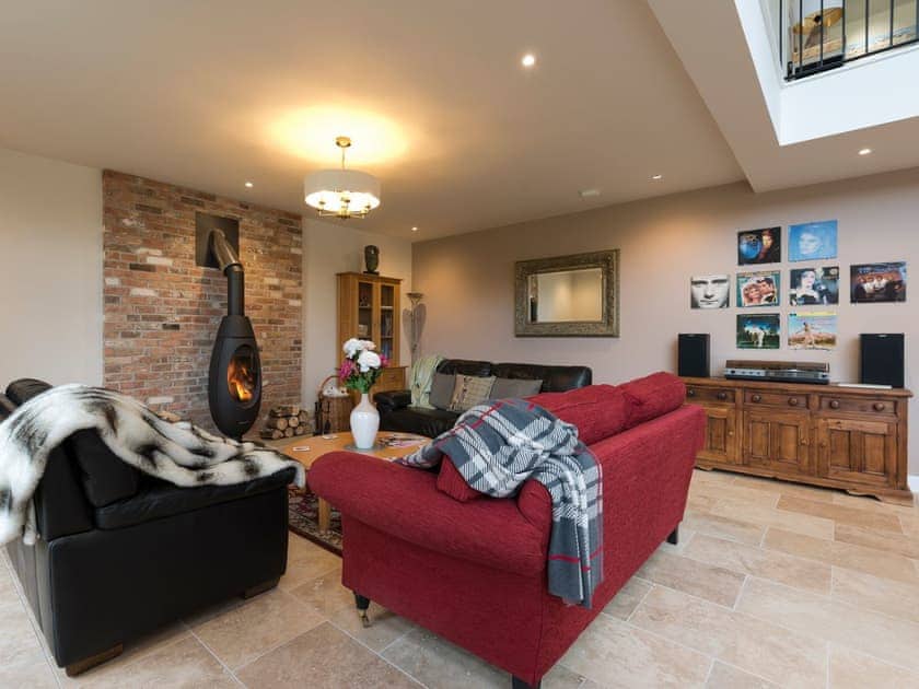 Cosy living area with wood burner | The Haybarn - Bedborough Farm Cottages, Wimborne