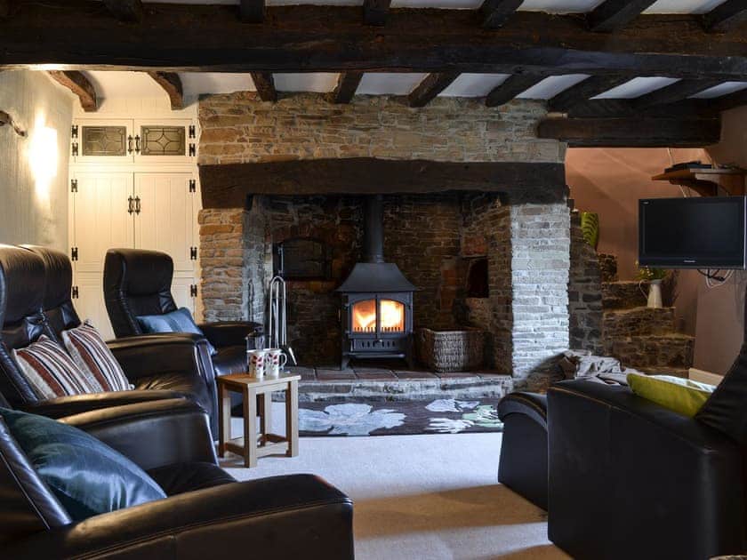 Cosy living room with wood burner | Isobel&rsquo;s Cottage - Whitelake Farm, Hiscott, near Barnstaple
