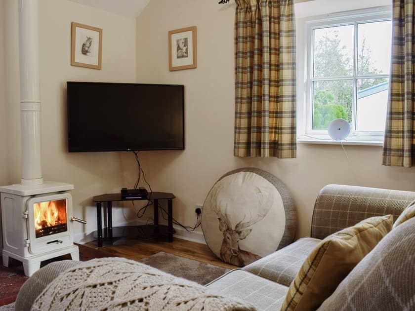 Charming living area with cosy wood burner | Bonnie&rsquo;s Bothy - Invertrossachs Estate Cottages, Invertrossachs, near Callander