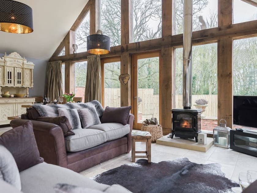 Lounge area with wood burner | Liliy Pad Lodge - Garden House Cottages, Market Stainton, near Market Rasen