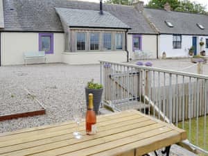 Beautiful holiday home with patio area | Sunset Cottage, Portmahomack, near Tain
