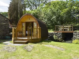 Glamping pod in the garden next to small waterfall  | Riverside Mill & Glamping Pod, Patton, near Kendal