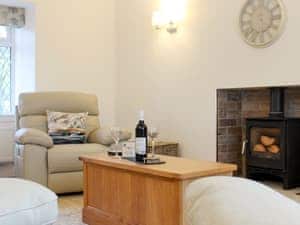 Delightful living room with wood burner | Rhunahaorine Cottage, Tayinloan, near Tarbert