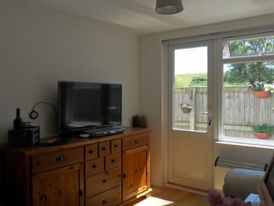 Charming open plan living space | Chalet One, Bridport