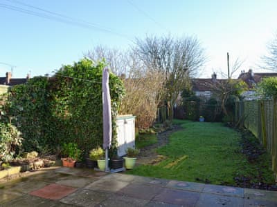 Lovely lawned garden with patio | Squirrel Cottage, Seamer, near Scarborough