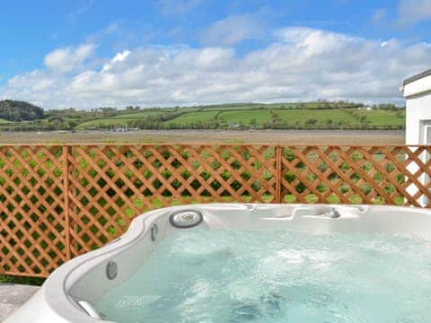 Relaxing hot tub with countryside views | Bronyn Cottage - Bronyn Farm, Ferryside, near Carmarthen