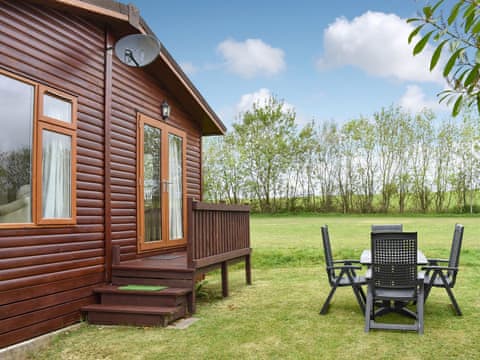 Exterior and sitting out area | The Lodge - Trecan Farm Cottages, Lanreath, near Looe