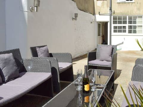 Courtyard with high quality outdoor furniture | Belfrey House, York