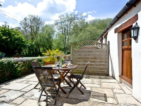 Patio area with outdoor furniture | The Smithy - Park Mill Farm, Chulmleigh