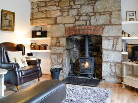 Cosy living room with feature fireplace | The Bellringers Cottage, Llandegla, near Llangollen