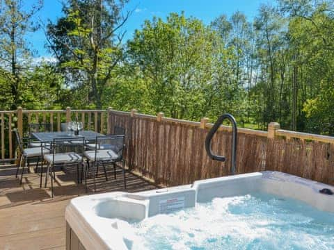 Relaxing hot tub on the decking | Maple Lodge, Otterburn, near Bellingham