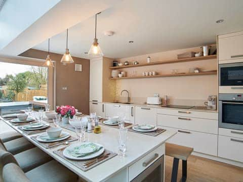 Luxurious kitchen with dining island | Hydrangea House, Hythe