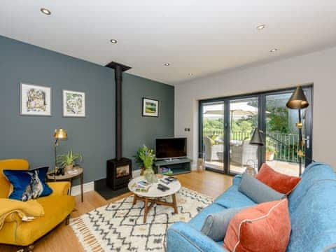 Lounge area with wood burner | Hen Harrier Lodge - Bowland Holiday Cottages, Abbeystead, near Lancaster