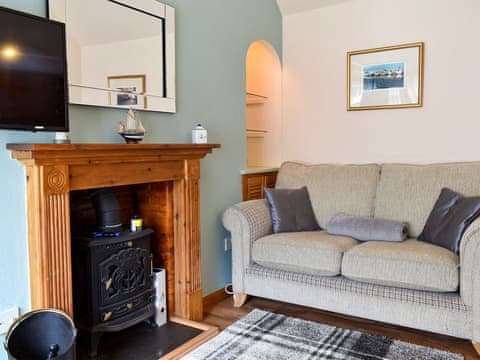 Cosy living area with wood burner | Heron Cottage, Lossiemouth
