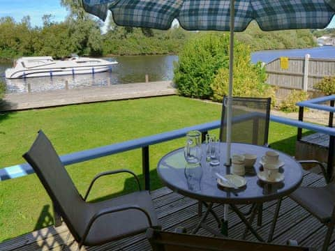 Decking area with delightful river views/ access | Silver Bream, Brundall, near Norwich