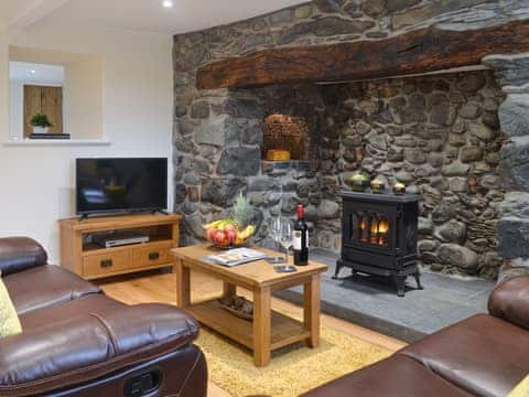 Living room with Inglenook fireplace | Pen Parc, Bryncrug, near Tywyn