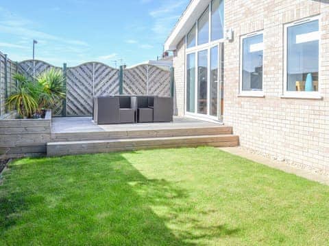 Lawned garden with sitting out area | Grays Cottage, Bridlington