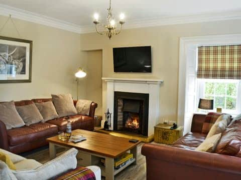 Beautifully presented living room with open fire | Altbeg, Isle of Arran