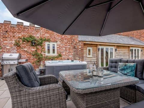 Paved patio area with outdoor furniture, BBQ and hot tub | Deer View Cottage - Salhouse Hall, Salhouse, near Norwich