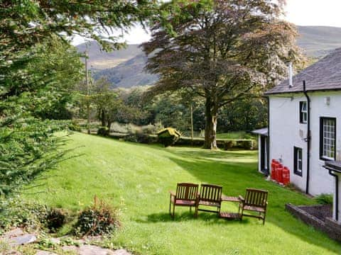 Beautiful gardens with sitting out areas | Lorna&rsquo;s At The Grange - Grange Country House Holiday Cottages, Loweswater, near Cockermouth