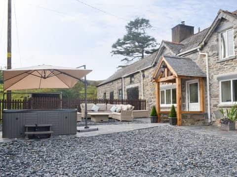 Delightful stone-built holiday cottage with hot tub | Tyddyn Eli, Llangwm, near Corwen