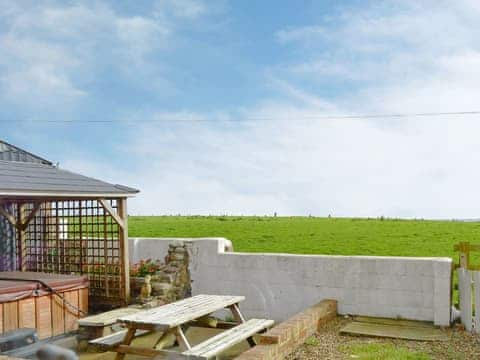 Garden area with hot tub and sea views | Old Low Farm Cottage, Aldbrough, near Hornsea