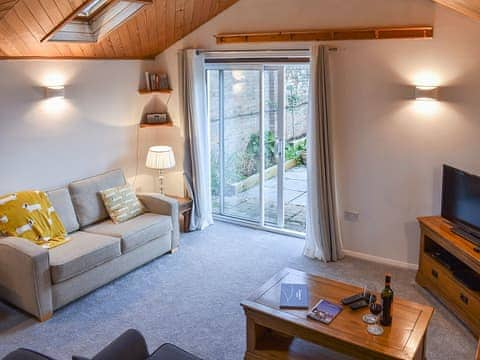 Living room with sliding doors to the garden | The Cottage By The Sea Annexe - The Cottages by the Sea, Littlehampton, near Arundel