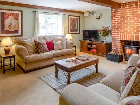 Delightful living room with wood burner | The Grain Store - Marshwood Manor Cottages, Bettiscombe, near Lyme Regis