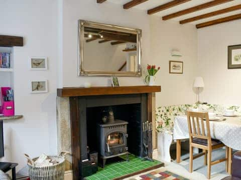 Charming living/ dining room with wood burner | Rose Cottage, Lofthouse, near Harrogate