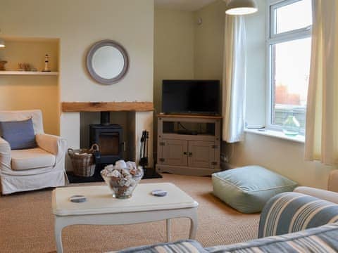 Warm and cosy living room with woodburner | Honeysuckle Cottage, Watchet