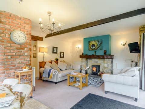 Delightful living area with a wood burner | The Forge - Laskill Grange, Bilsdale, near Helmsley