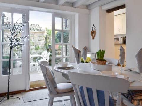Light and airy dining area with access to patio | Toad Hall, Helmsley