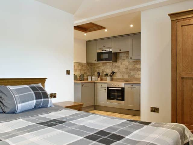 Stylish double bedroom space | The Byres Methera - Stone House Farm Holiday Cottages, St Bees, near Whitehaven