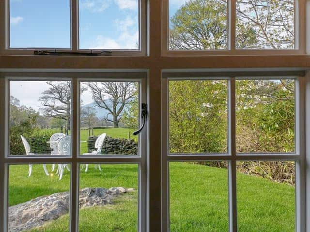 Garden views from the bedroom | Field House Lodge - Field House Cottages, Borrowdale, near Keswick