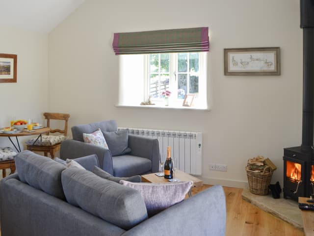 Charming open plan living space with wood burner | Spindle Well Barn, Elsdon, near Otterburn